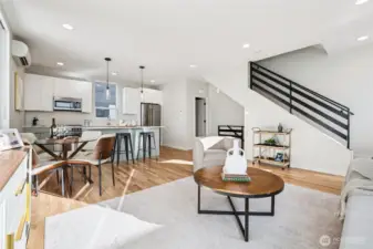 Sunlight fills every space to accentuate hardwood floors, high-end blinds, and stylish finishes throughout.