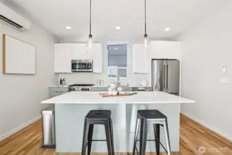 Another rarity in a townhome: a true gathering space like this in the kitchen. Tons of space for multiple chefs plus those who love to watch you work.
