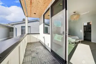 A sweet south-facing balcony off of the primary is a wonderful place to enjoy morning coffee or yoga while the city comes to life around you.