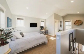 Interior view 1 of upper level 1 bedroom 3/4 bath carriage house with kitchette and living space.