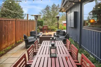 The side yard has been transformed into a fabulous patio bistro and outdoor hangout.