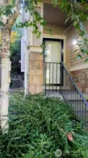 More Pictures coming! Covered front porch with stylish aggregate steps and durable, metal handrail.  Notice the storm door, which does lock.
