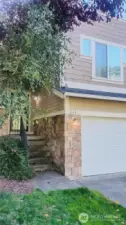 More pictures coming!  This home has stone accent exterior and the color scheme is neutral earth tones throughout.  The driveway is almost completely level.