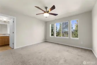 Primary bedroom with  ceiling fan.  The house has central AC too