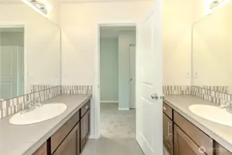 Dual sinks in upstairs main bathroom.