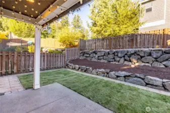 Covered patio with updated lawn/sod.