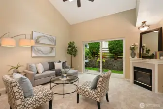 A cozy gas fireplace and large slider to outside invite you to relax & refresh.