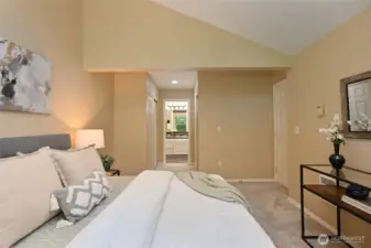 Your Ensuite awaits at the end of a hallway with spacious closets on either side.