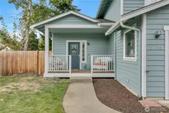 Charming covered front porch to your new home