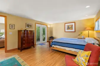 Primary suite showing access to private patio