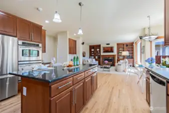 Kitchen flows seamlessly to nook and family room.