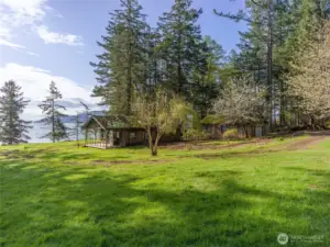 Looking towards the original cabin and shop out towards the water.