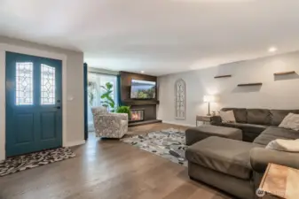 Beautiful front living room with shiplap fireplace and floating mantle