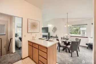 View from the kitchen into the living and dining rooms.