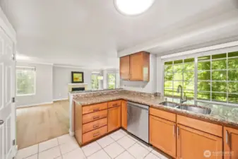 View to kitchen from Living room. Door to private deck to left of kitchen. Storage closet on deck. So private!