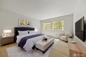 Primary bedroom with new flooring underfoot and fresh interior paint. Lots of room for even a King Sized bed.