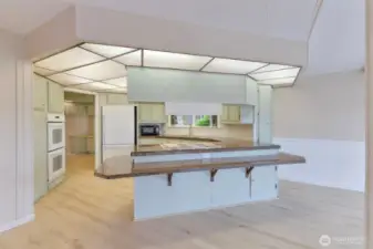 Great kitchen with chair height counter for extra dining options.