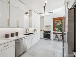New kitchen and appliances, quartz countertops, marble floors.