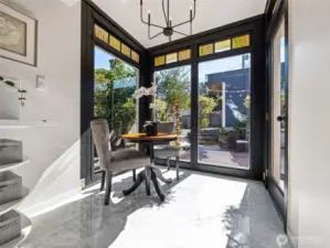 In-dining kitchen, with large views of the mature trees and yard,.