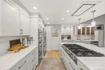 Behind the door is a walk-in pantry.