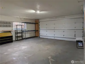 Large 2 car garage with oversized 18' door & tall ceilings. #2111 5th St SW, Puyllup, WA 98371