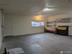 Large 2 car garage with oversized 18' door & tall ceilings. #2111 5th St SW, Puyllup, WA 98371