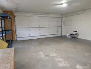 Large 2 car garage with oversized 18' door & tall ceilings. #2111 5th St SW, Puyllup, WA 98371