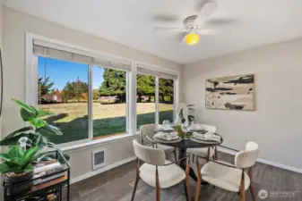 Expansive kitchen with large windows to take in the view of the expansive lawns and pool space.