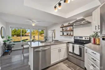 Updated kitchen with new appliances and big bright windows.