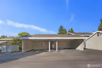 Covered parking steps from your door. With extra storage unit.