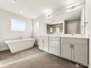 Serene primary bath with soaking tub.