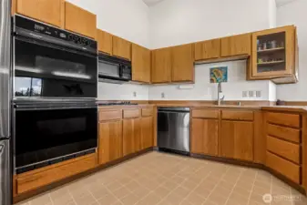 Kitchen stocked with double oven and lots of cabinet space