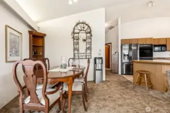 Small hallway past the kitchen leads to guest bathroom and primary suit