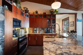 Another view of the kitchen which is open to the breakfast nook and dining areas.