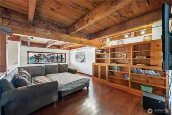 The rec room also has the reclaimed wood ceiling and beams as well as built-ins.