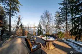 There is a lower patio with a fire pit just above the trail that leads you to the incredible beach.