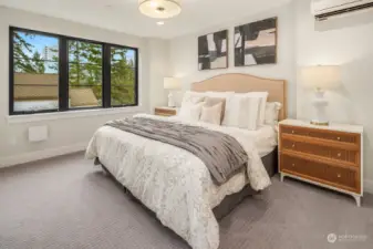 Generous primary bedroom with views of downtown Bellevue