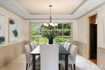 Large dining room with bowed window