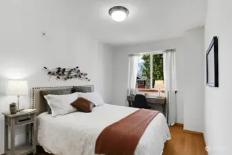Secondary bedroom with neighborhood view, provides space for a queen-sized bed and desk or dresser
