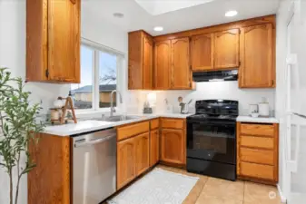 Kitchen with all new appliancs and oak cabinetry.