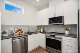 Bright an airy chef's kitchen with premium appliances for the home chef. (Photos are of staged model home.)