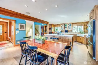 The great room is perfect for entertaining. Front entry on the far left, with stairs up and down in the background.