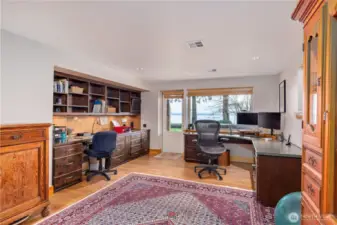 You'll love the full-on views in this beautiful den, and the built-in cabinets, desk space and access to the patio.