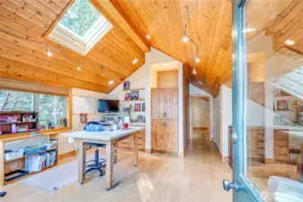 Designed to match the main home's interior, the 1-bdm apartment has been used an art studio and guest space.