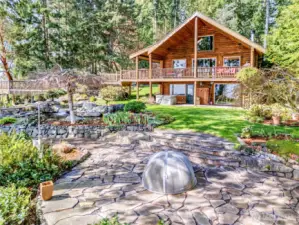 The quality and beauty of landscaping is unsurpassed with patios, waterfall, garden, forest trails & stunning views.