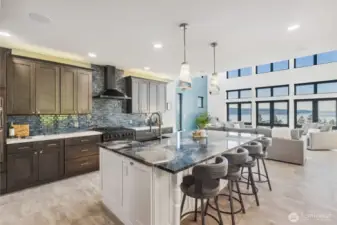 Custom made cabinetry and elegant designer counters and tiled backsplash