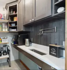 Walkin pantry adjacent to kitchen and YES! that is a built in coffee bar and sink
