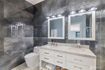 Primary bathroom with floor to ceiling stone