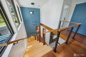 Grand staircase from upper level to main level.