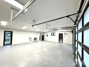 Bright and open garage with ample work space and room for the toys. Electric car charger
